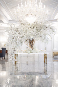 Class Event Rentals Wedding in white theme with Athena table adorned with white flowering tree