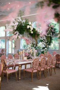 Class Event Rentals Rosabelle Chairs in pink with gold rose accents in Pink Garden wedding setting