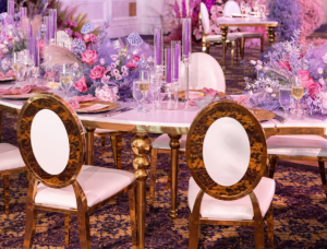 Class Event Rentals Wedding setting with Xiomara chairs, serpentine table and colorful centerpieces