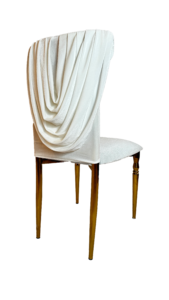 An elegant chair with dark wooden legs and a white upholstered seat, draped with a creamy, textured throw blanket against a plain background.