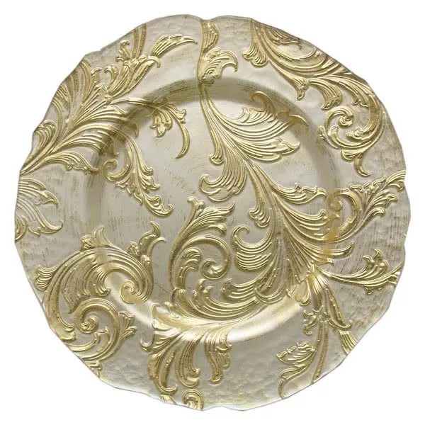 A decorative gold charger plate featuring intricate floral and scroll designs, displaying a textured and shiny finish against a white background.