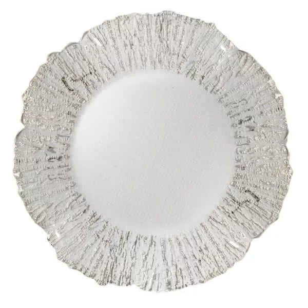 A decorative white ceramic charger plate featuring a textured, radial pattern that simulates the appearance of chiseled crystal around its rim, with a smooth center.