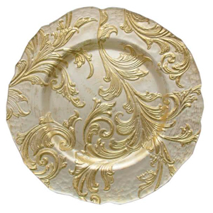 A decorative charger plate rental with an ornate gold leaf pattern of swirling vines and leaves on a creamy white background, featuring a scalloped edge.